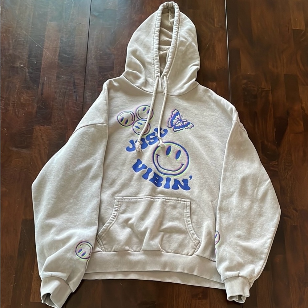 Hoodie with smiley faces and a butterfly